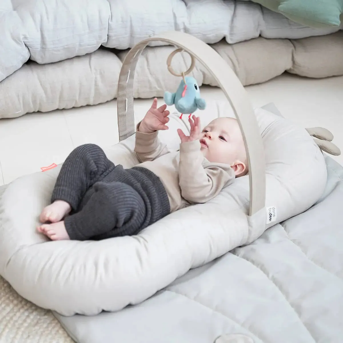 Done by Deer Cozy Lounger with Activity Arch – Raffi Sand